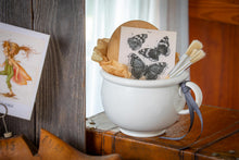 Load image into Gallery viewer, ironstone chamber pot vignette with wooden board, paint brushes, and butterfly illustration