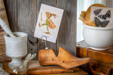 Load image into Gallery viewer, antique wooden shoe form with illustration of a field piskie
