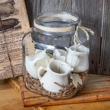 Load image into Gallery viewer, vintage jar with 4 ironstone creamers and fall touches
