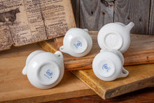 Load image into Gallery viewer, bottom view of 4 ironstone creamers

